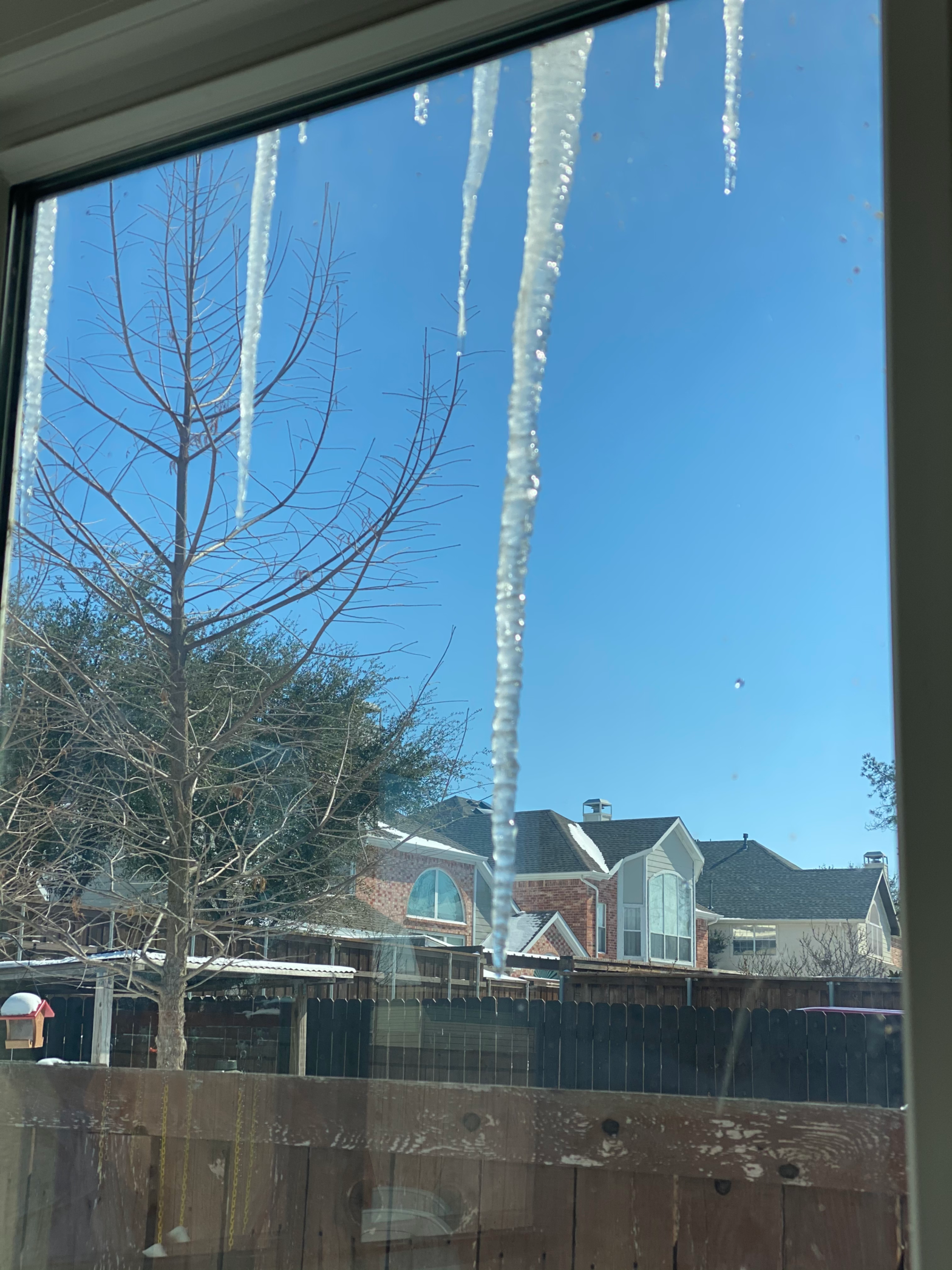 Icicles as seen from a house window during the Texas Winter Storm of 2021
